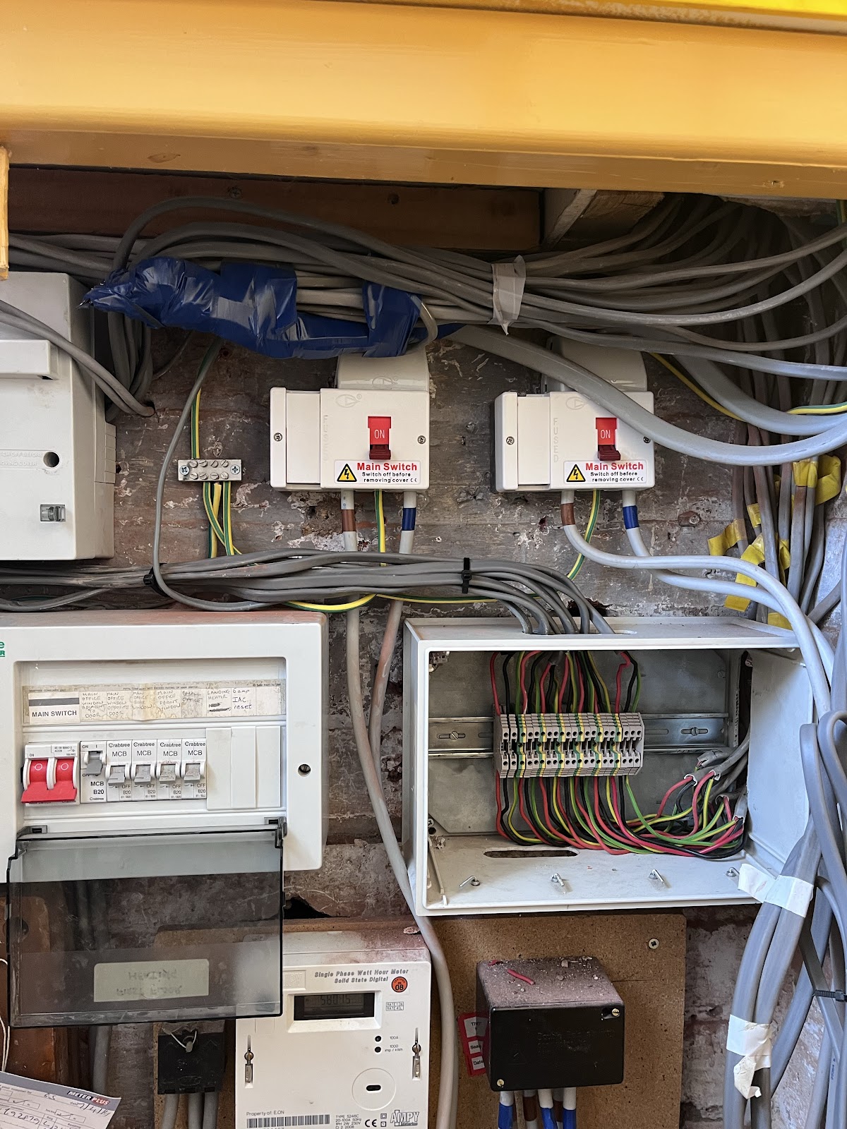 Electricians in Stafford installing sockets and wiring in a domestic property