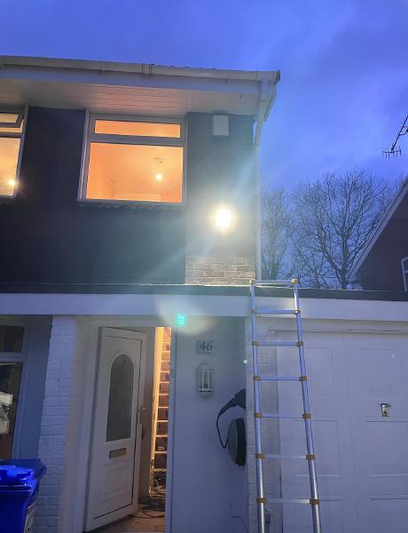LED security floodlight installed on a house frontage at dusk in Staffordshire