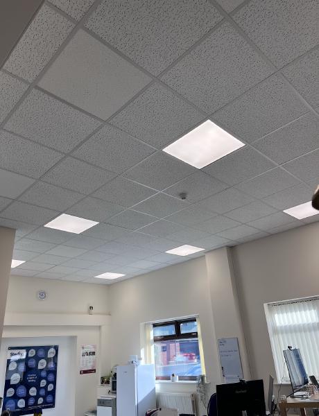 Recessed LED panel lights in a suspended office ceiling in Stafford