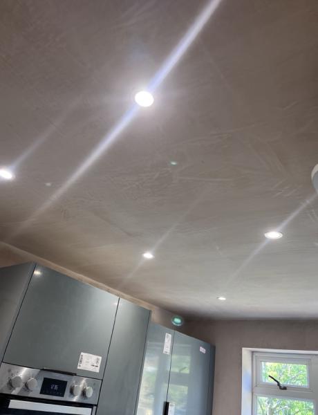 New LED downlights set into a freshly plastered kitchen ceiling